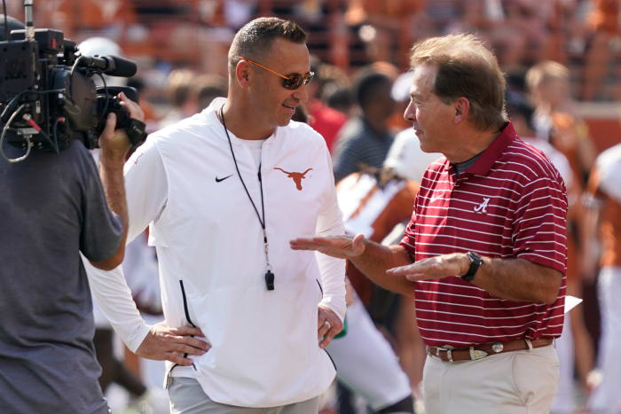 Texas Longhorns head coach Steve Sarkisian talks with Alabama Crimson Tide head coach Nick Saban before the game at Darrell K Royal-Texas Memorial Stadium.